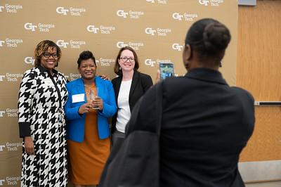 Award winners taking photos with colleagues. 