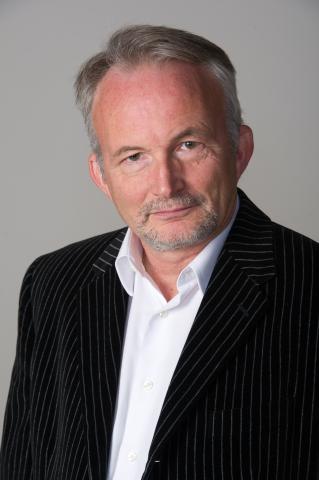 Portrait photo of School of Public Policy professor Milton Mueller