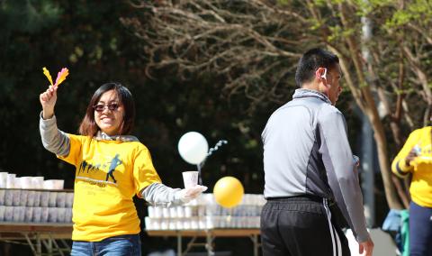 Volunteer cheering at the Publix Georgia Marathon