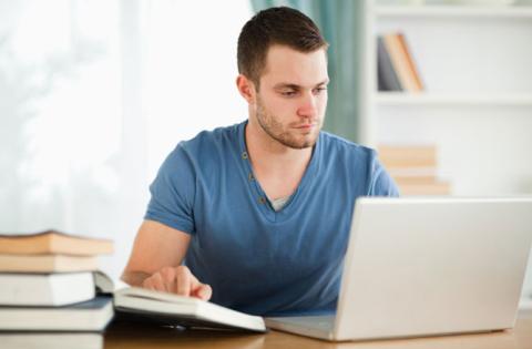 student with computer