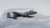 An A-10 Thunderbolt II flies through cloudy skies. (Photo: Airman 1st Class Taylor K. Walker, U.S. Air National Guard)
