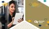 Woman with dark hair and black top looks at a tablet. Image includes the Georgia Tech logo.