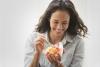 woman eating fruit cup 