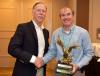 Professor Matthew Realff Receives the Carpet America Recovery Effort Person of the Year Award from CARE representative.